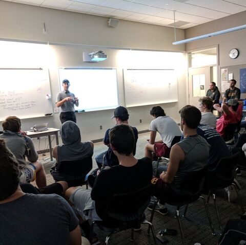 Kevin Alschuler, PhD, giving a sport psychology presentation to a team